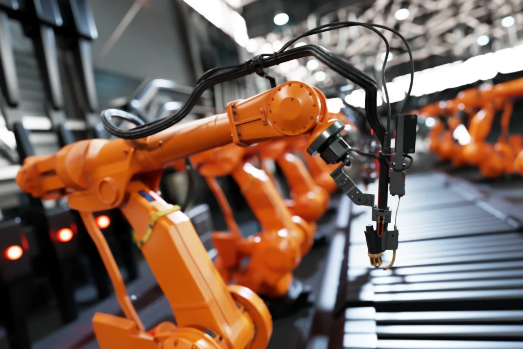 Tekoäly teollisuudessa blogin kuvituskuva, robotteja tuotantolaitoksessa.